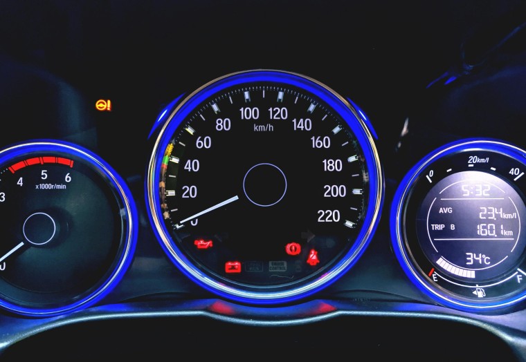 dashboard of a car showing speedometer